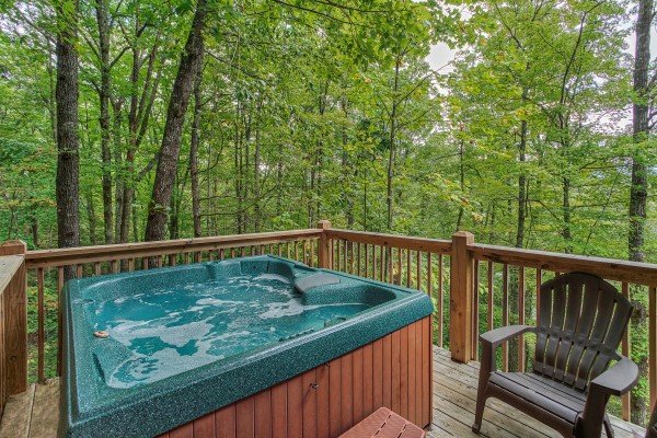 Hot tub with wooded view at Black Bear Magic, a 4-bedroom cabin rental located in Gatlinburg